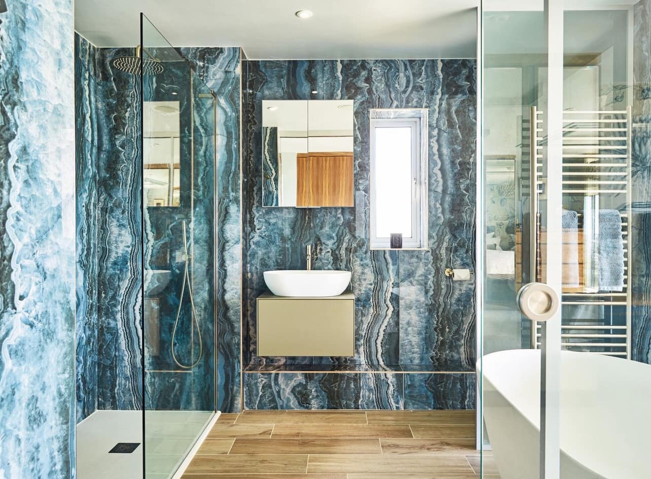 A marble bathroom finished by Always Cleaning Services after the builders left, every surface mirror-clean.